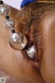 A close up of a person with a pair of earrings on their ear.