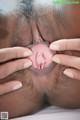 A close up of a woman's pussy with her hands on her pussy.